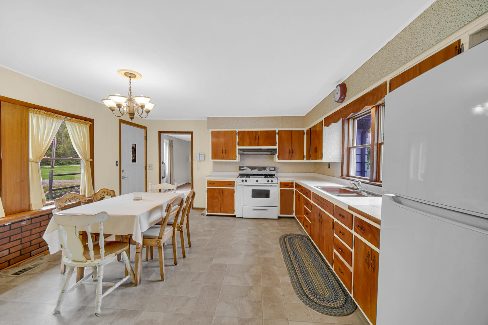 1288 North Brummitt Road Chesterton, IN 46304 - Photo 6 of 23 a view of a dining room with furniture window and wooden floor