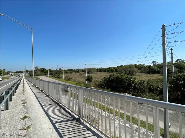 a view of a road with a yard