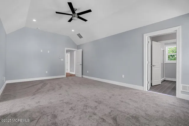 a view of a swimming pool and lounge chairs