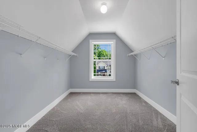 an aerial view of a house with a yard basket ball court and outdoor seating