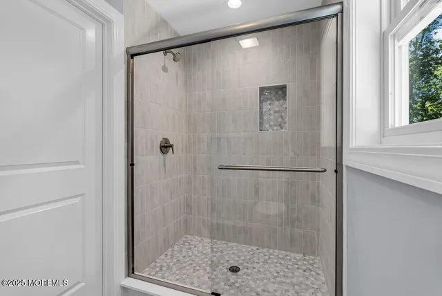a picture of a bathroom with a shower