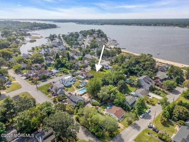 a view of a hallway with wooden floor and entryway