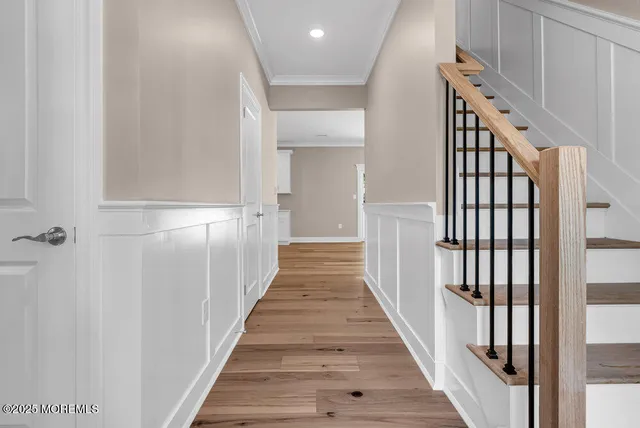 a kitchen with stainless steel appliances granite countertop white cabinets and a stove