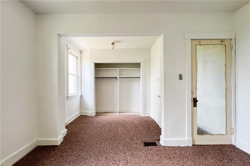 509 North Mathilda Street Pittsburgh, PA 15224 - Photo 11 of 24 a bedroom with a bed and a window