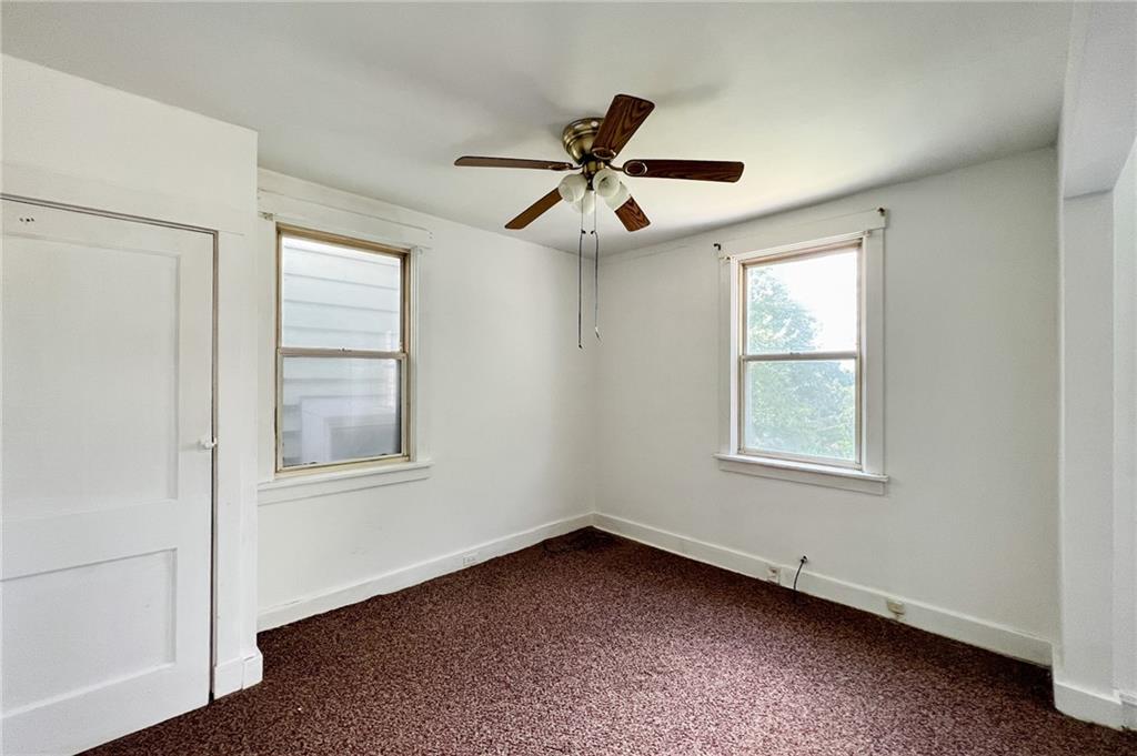 509 North Mathilda Street Pittsburgh, PA 15224 - Photo 13 of 24 an empty room with a window and a fan