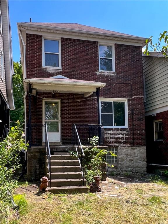 509 North Mathilda Street Pittsburgh, PA 15224 - Photo 23 of 24 a front view of a house with stairs