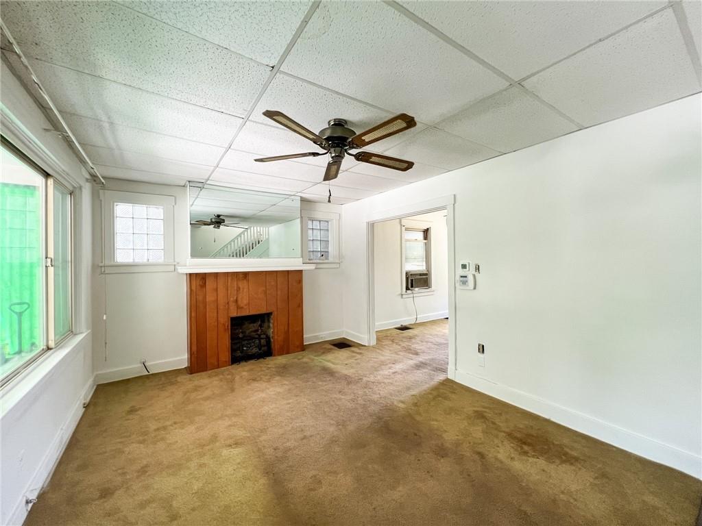 509 North Mathilda Street Pittsburgh, PA 15224 - Photo 3 of 24 an empty room with windows and ceiling fan