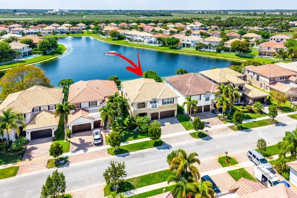 a bathroom with a sink a toilet a mirror and shower