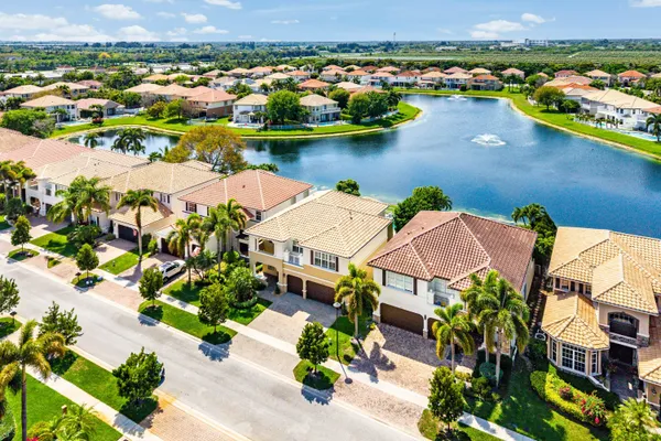 an empty room with a ceiling fan and window