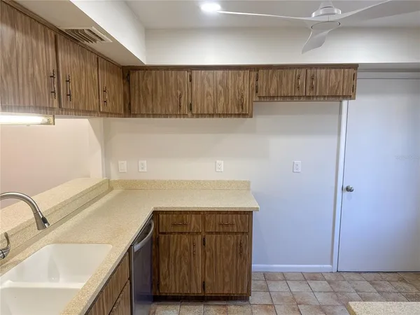a kitchen with a sink and cabinets