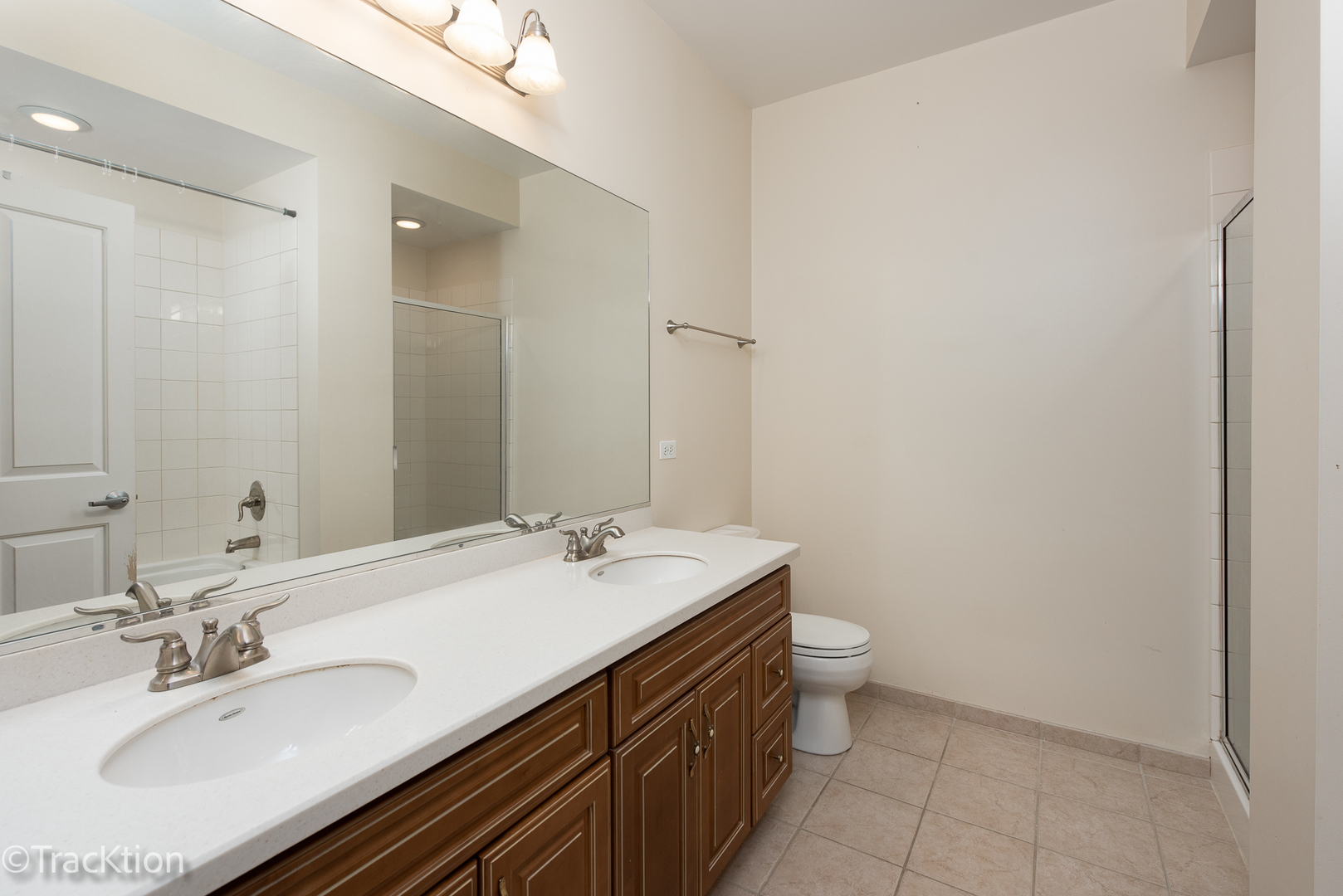 977 Harris Road, Unit 16 Grayslake, IL 60030 - Photo 14 of 41 a bathroom with a sink a toilet a mirror and vanity