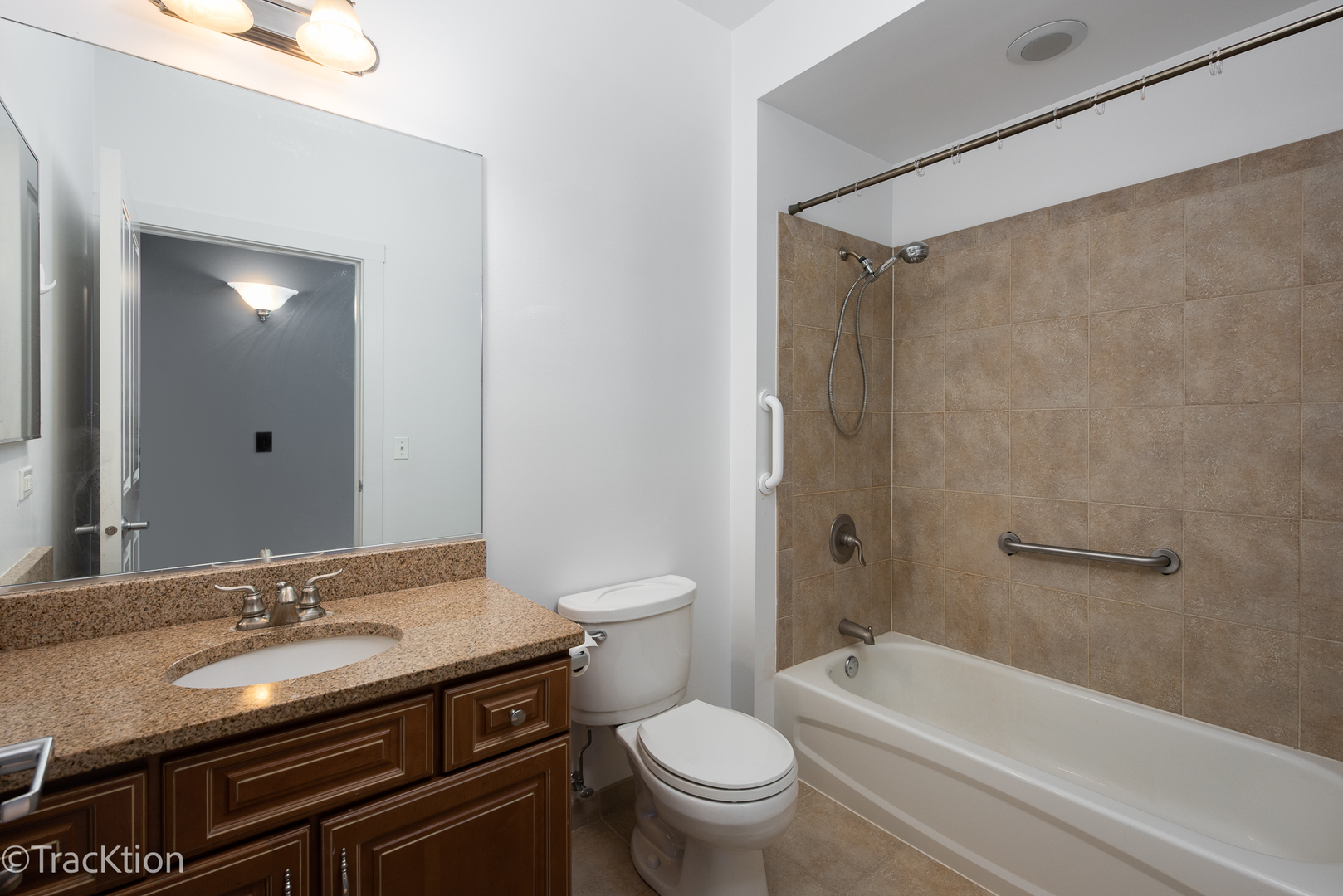 977 Harris Road, Unit 16 Grayslake, IL 60030 - Photo 16 of 41 a bathroom with a sink a toilet and a mirror