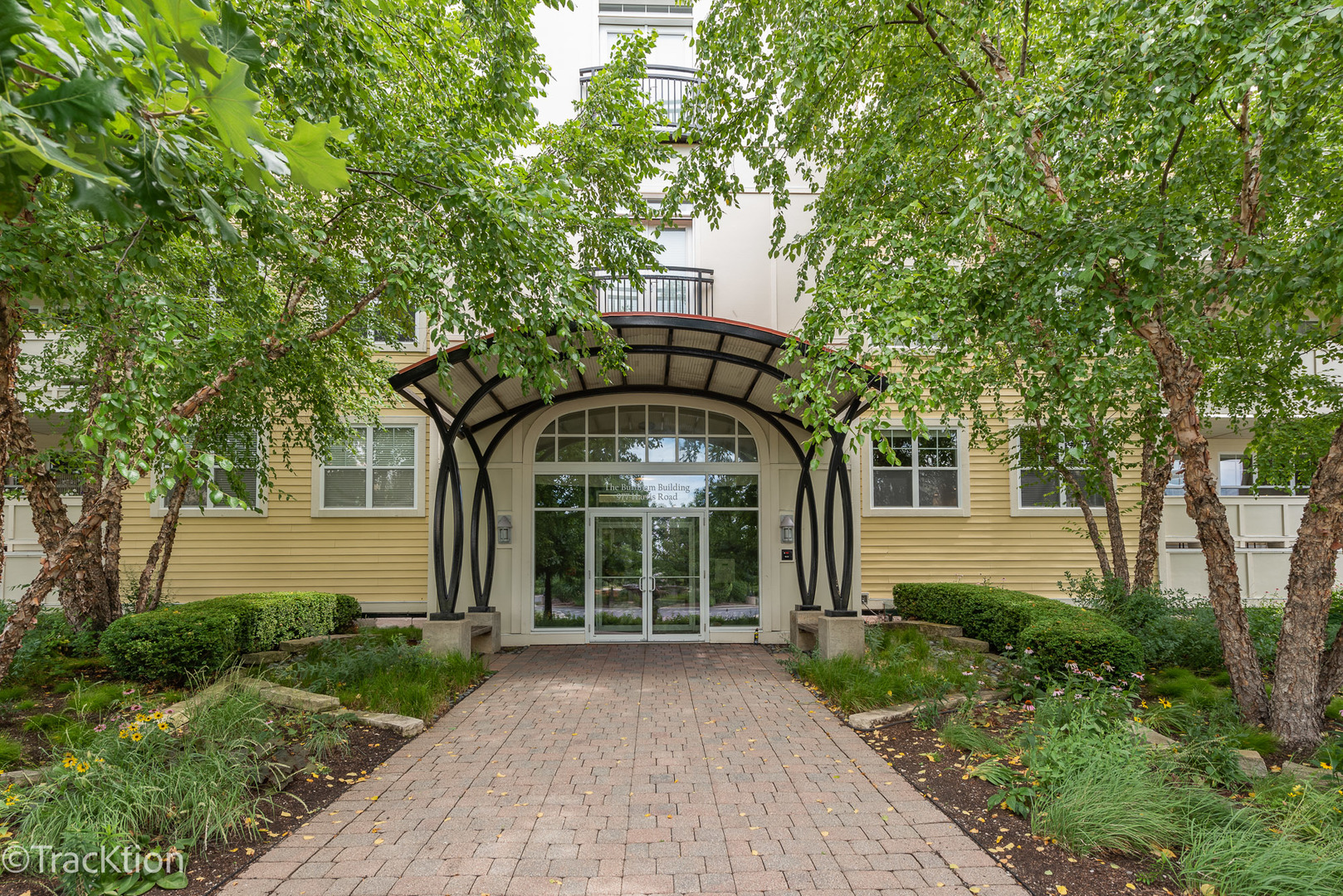 977 Harris Road, Unit 16 Grayslake, IL 60030 - Photo 3 of 41 a front view of a house with a garden