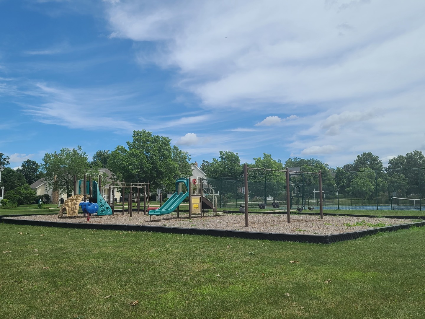 977 Harris Road, Unit 16 Grayslake, IL 60030 - Photo 32 of 41 a view of a park with swings and slides