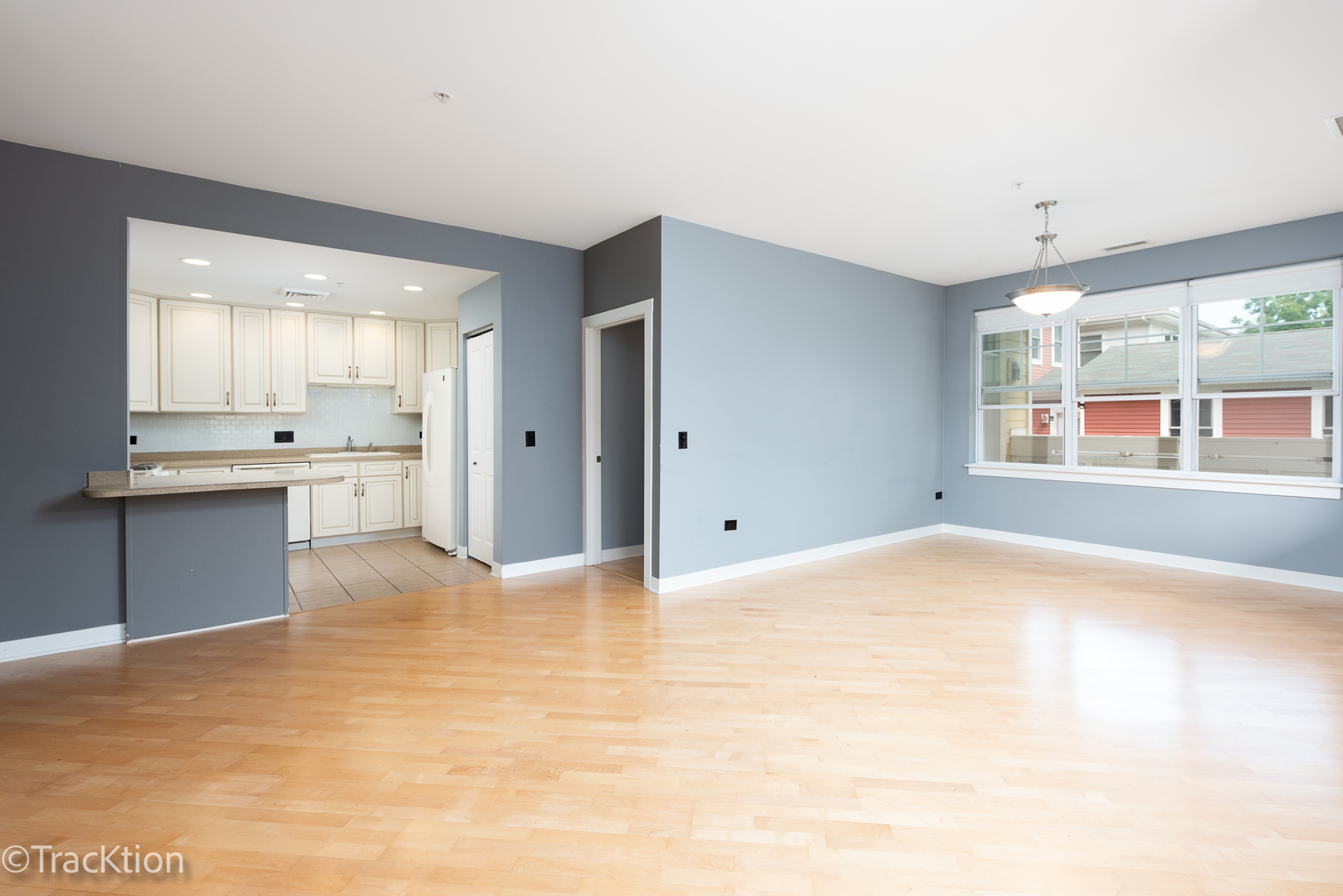977 Harris Road, Unit 16 Grayslake, IL 60030 - Photo 8 of 41 a view of an empty room with window and wooden floor