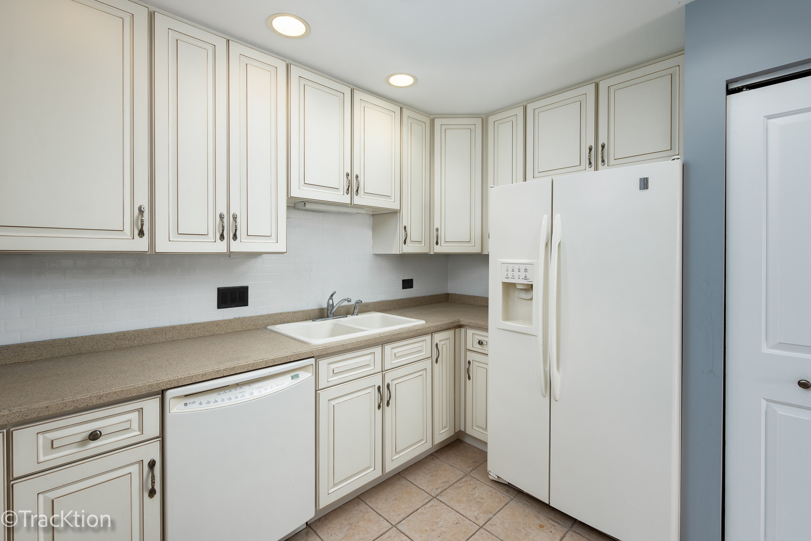 977 Harris Road, Unit 16 Grayslake, IL 60030 - Photo 9 of 41 a view of a kitchen with white cabinets