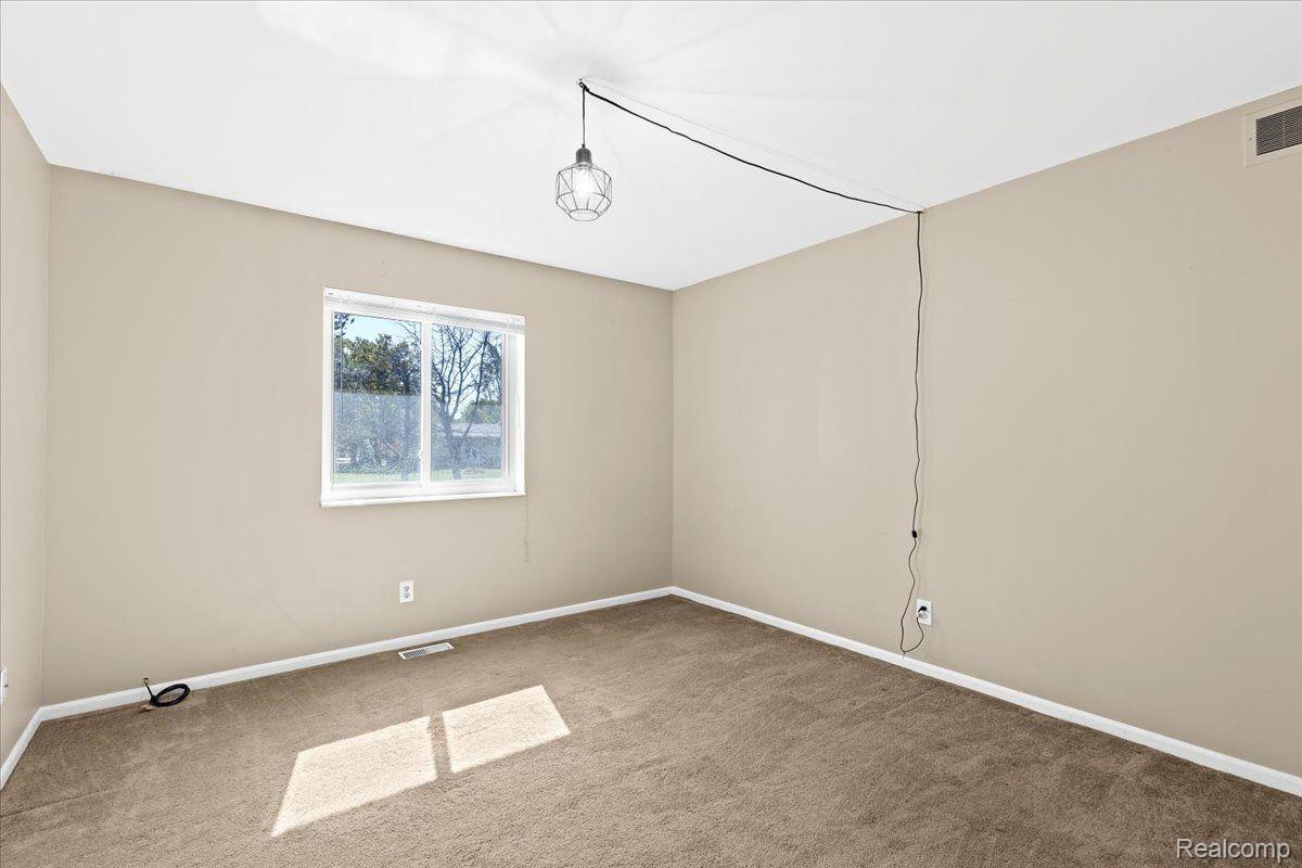 7677 McClements Road Brighton, MI 48114 - Photo 14 of 25 Bedroom 3