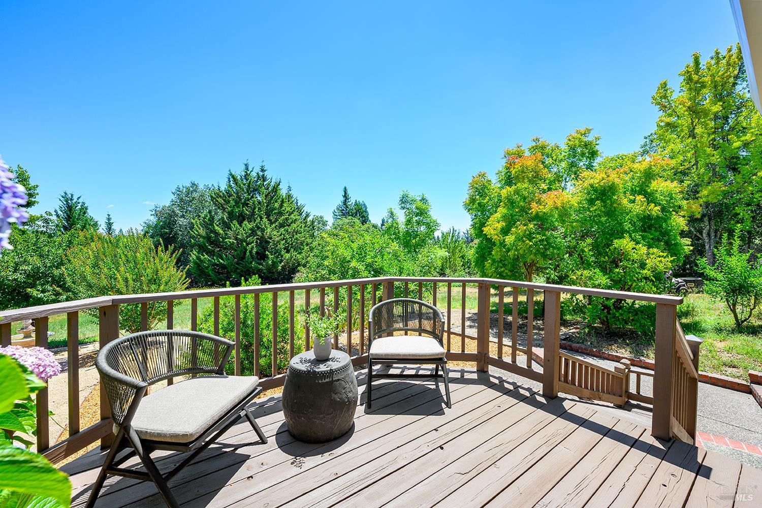 7595 Giusti Road Forestville, CA 95436 - Photo 31 of 41 a balcony with wooden floor table and chairs