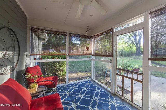 a view of a park with large trees