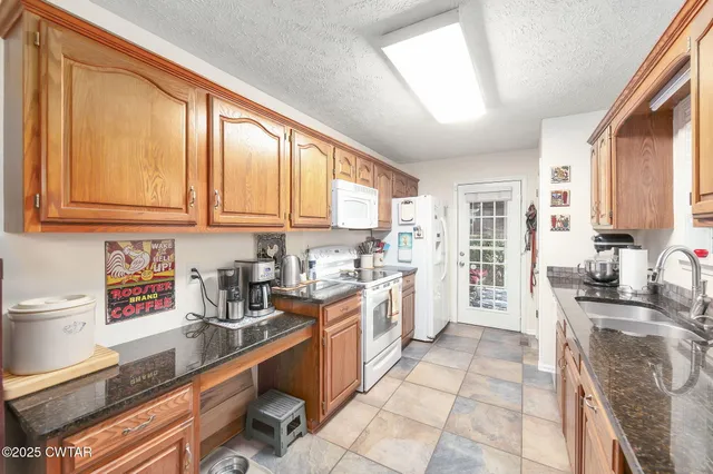 a view of a dining room with furniture wooden floor and chandelier