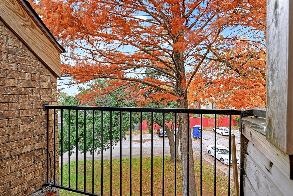 9801 Walnut Street, Unit 212 Dallas, TX 75243 - Photo 15 of 16 a view of staircase with a trees from a balcony