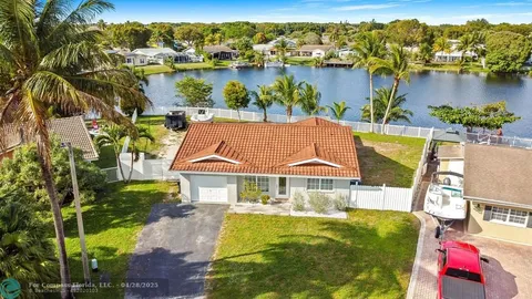 an aerial view of houses with yard