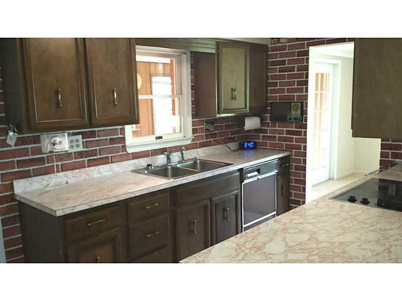 Exterior Front. Kitchen opens up to living room/dining room, family room and laundry area.
