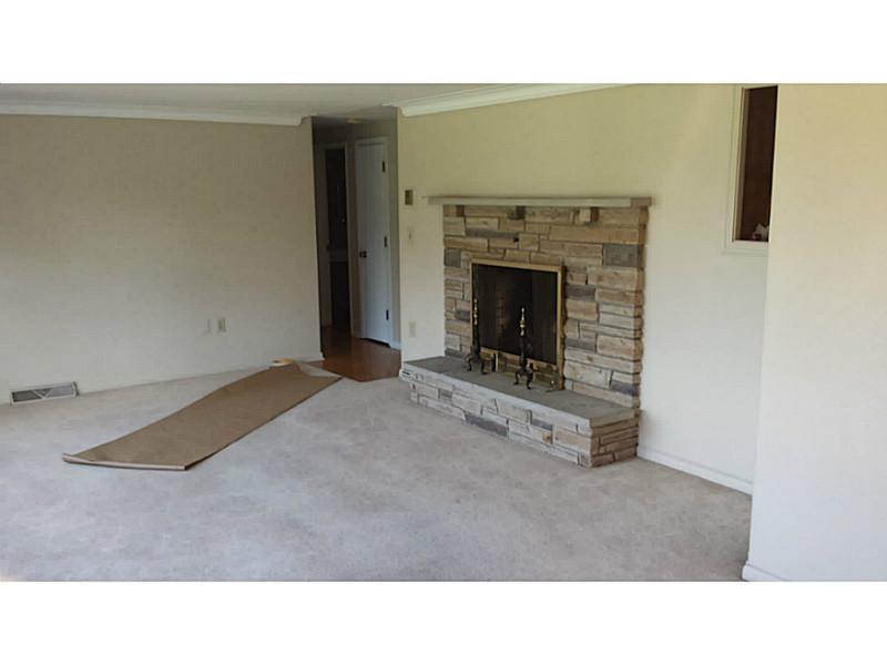 Exterior Front. Large living room with dining area off the kitchen has been freshly painted.