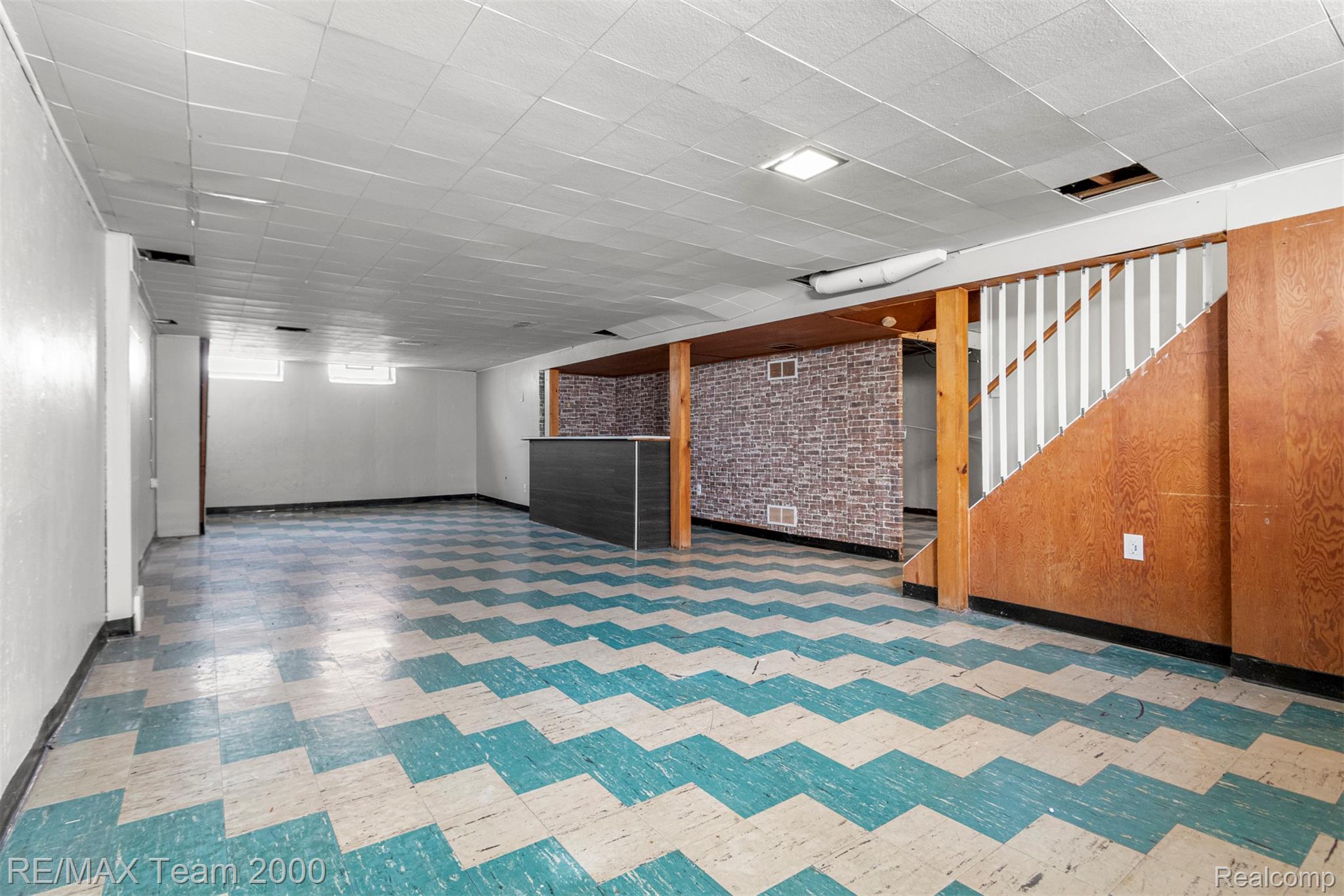 19431 Stephens Road Eastpointe, MI 48021 - Photo 32 of 46 Finished basement featuring stairs and light floors
