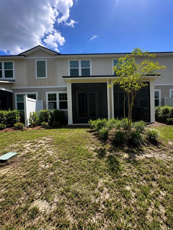 339 Redbud Road Palm Coast, FL 32137 - Photo 21 of 22 a front view of a house with a yard