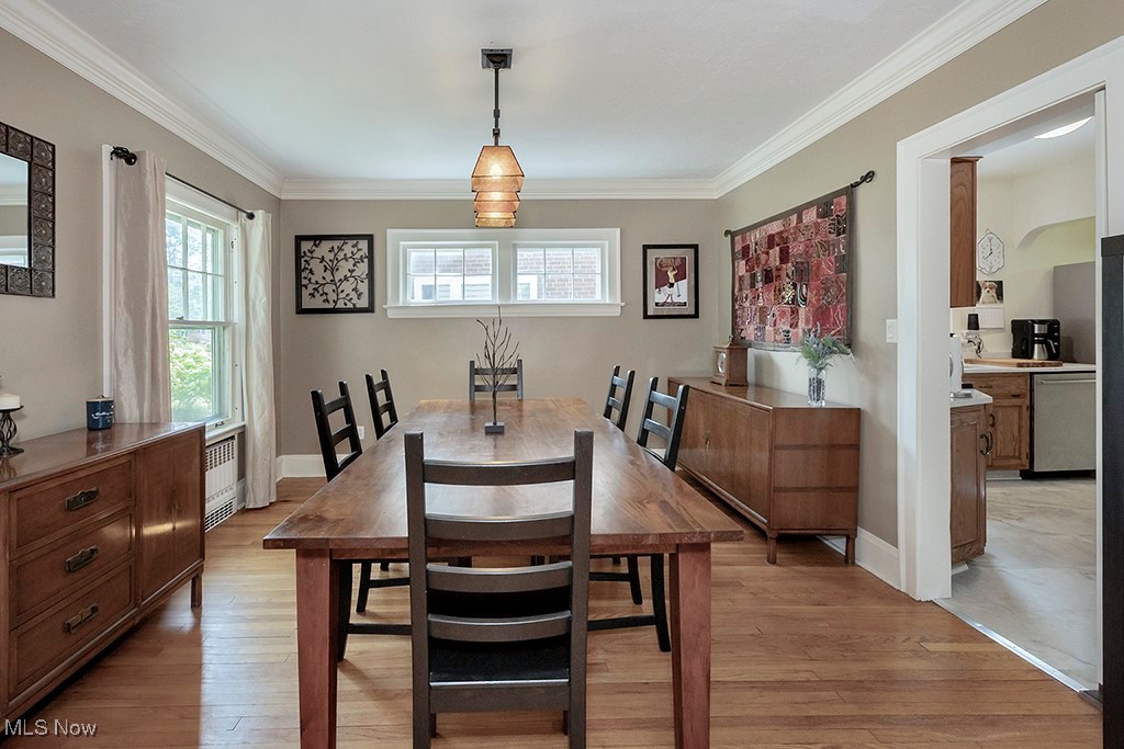 3256 Aberdeen Road Cleveland, OH 44120 - Photo 6 of 46 Dining space with light hardwood / wood-style flooring, crown molding, and radiator