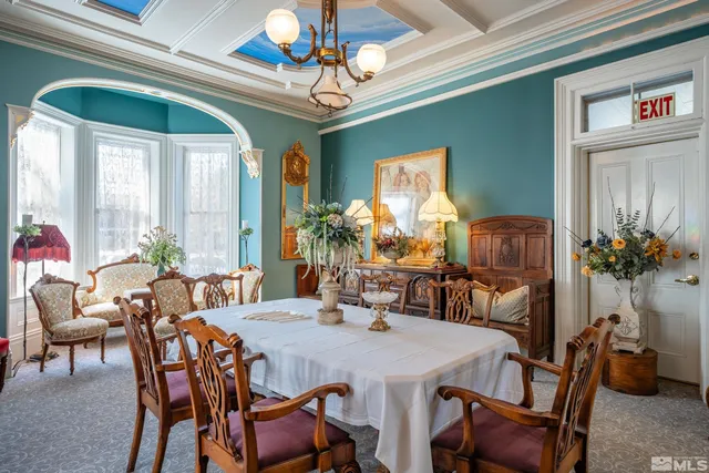 a view of a dining room with furniture window and outside view
