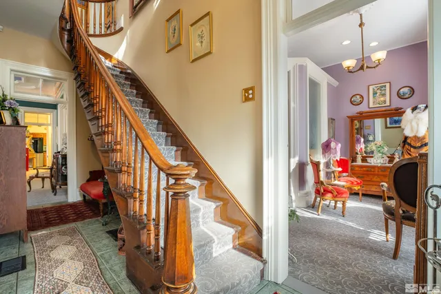 a view of an entryway with wooden floor