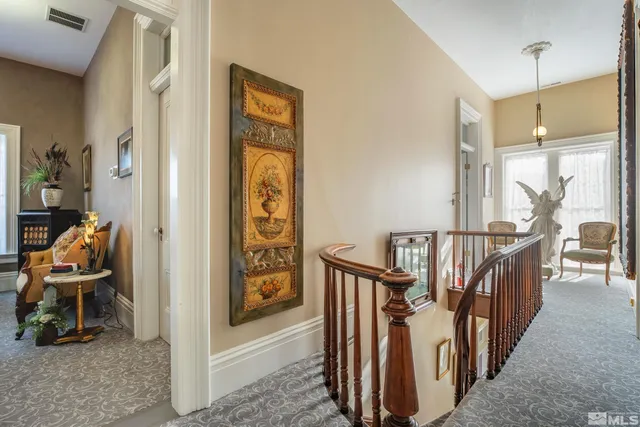 a view of an entryway with wooden floor