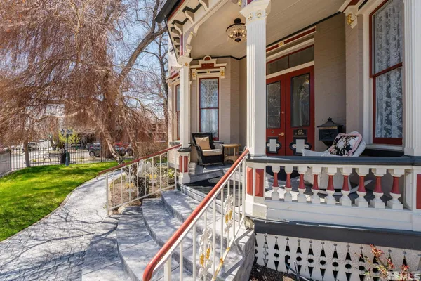 a view of balcony with two chairs and a table