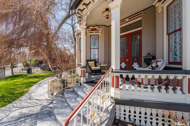 a view of balcony with two chairs and a table