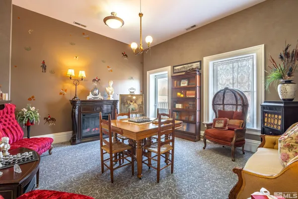 a view of a dining room with furniture window and outside view