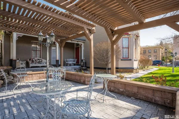 a view of living room with patio furniture and a garden