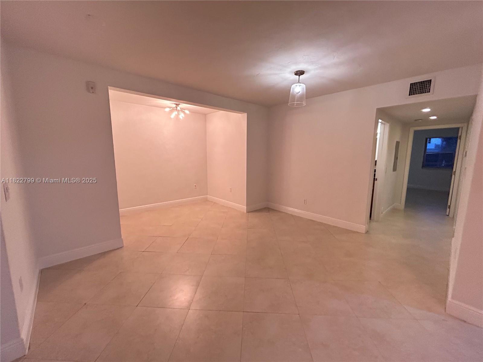 2880 Pine Tree Drive, Unit 1 Miami Beach, FL 33140 - Photo 3 of 13 a view of an empty room with a window