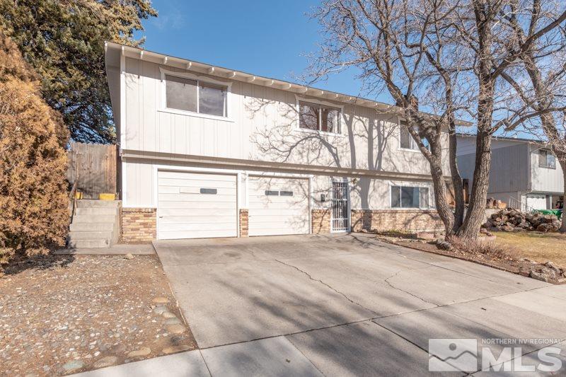 1755 Carlin Street Reno, NV 89503 - Photo 1 of 26 a view of a house with a large trees
