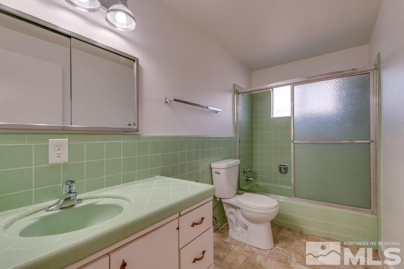 1755 Carlin Street Reno, NV 89503 - Photo 15 of 26 a bathroom with a sink toilet and shower