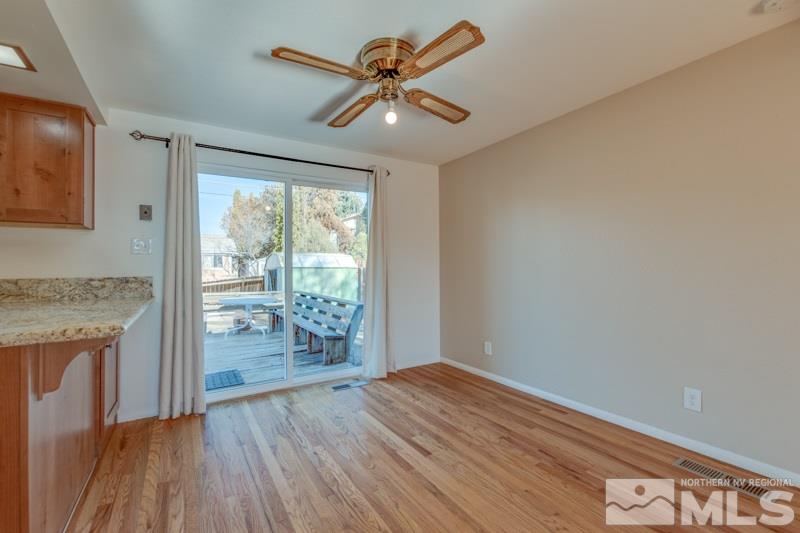 1755 Carlin Street Reno, NV 89503 - Photo 6 of 26 wooden floor in an empty room with a window