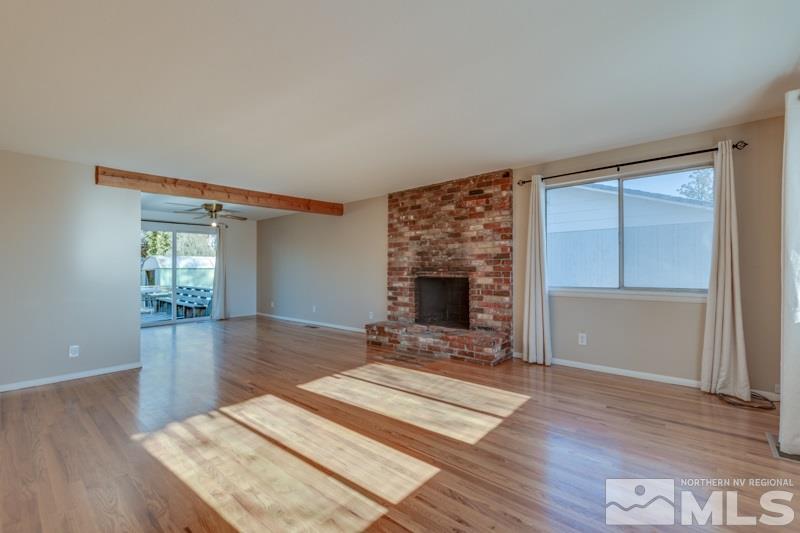 1755 Carlin Street Reno, NV 89503 - Photo 10 of 26 a living room with furniture and a fireplace