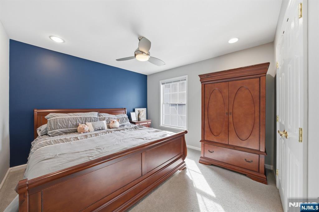 22 Falling Waters Oakland, NJ 07436 - Photo 17 of 43 a bedroom with a bed and a dresser