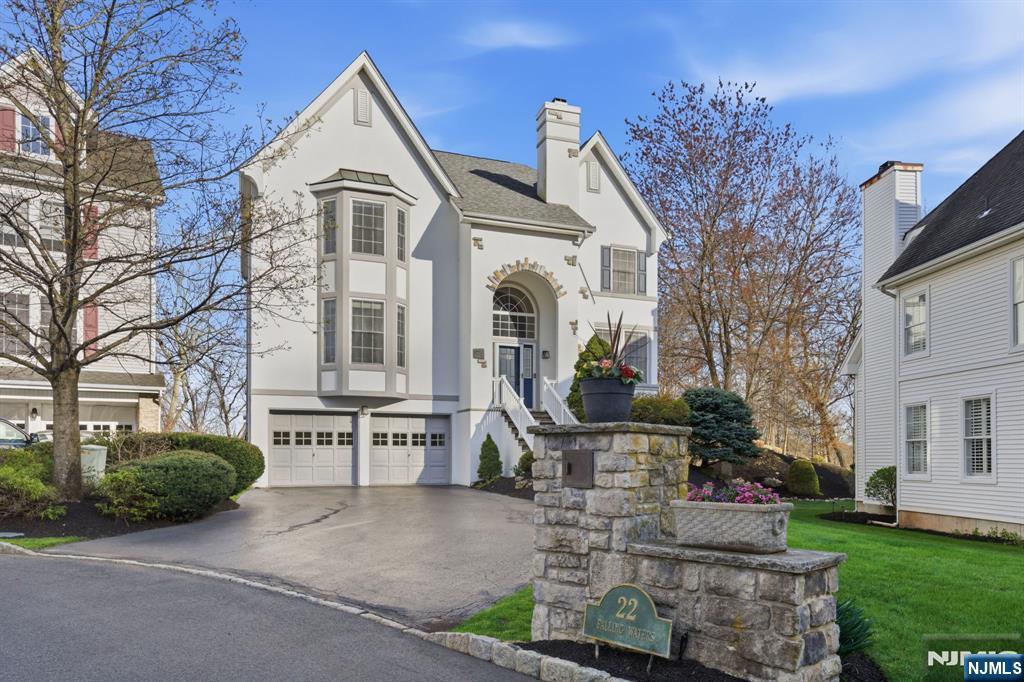 22 Falling Waters Oakland, NJ 07436 - Photo 2 of 43 a front view of a house with garden