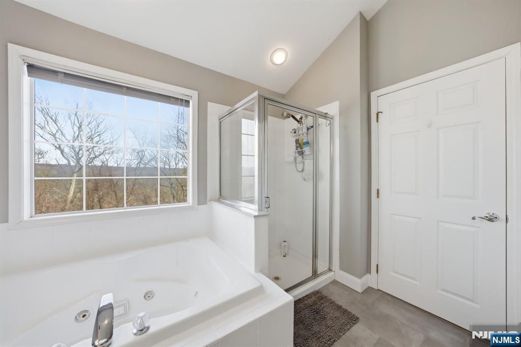 22 Falling Waters Oakland, NJ 07436 - Photo 26 of 43 a bathroom with a bathtub and a shower