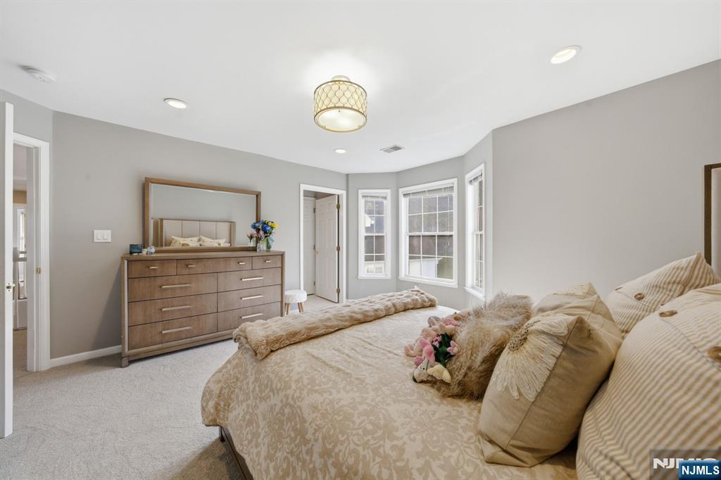 22 Falling Waters Oakland, NJ 07436 - Photo 28 of 43 a bedroom with a bed and closet