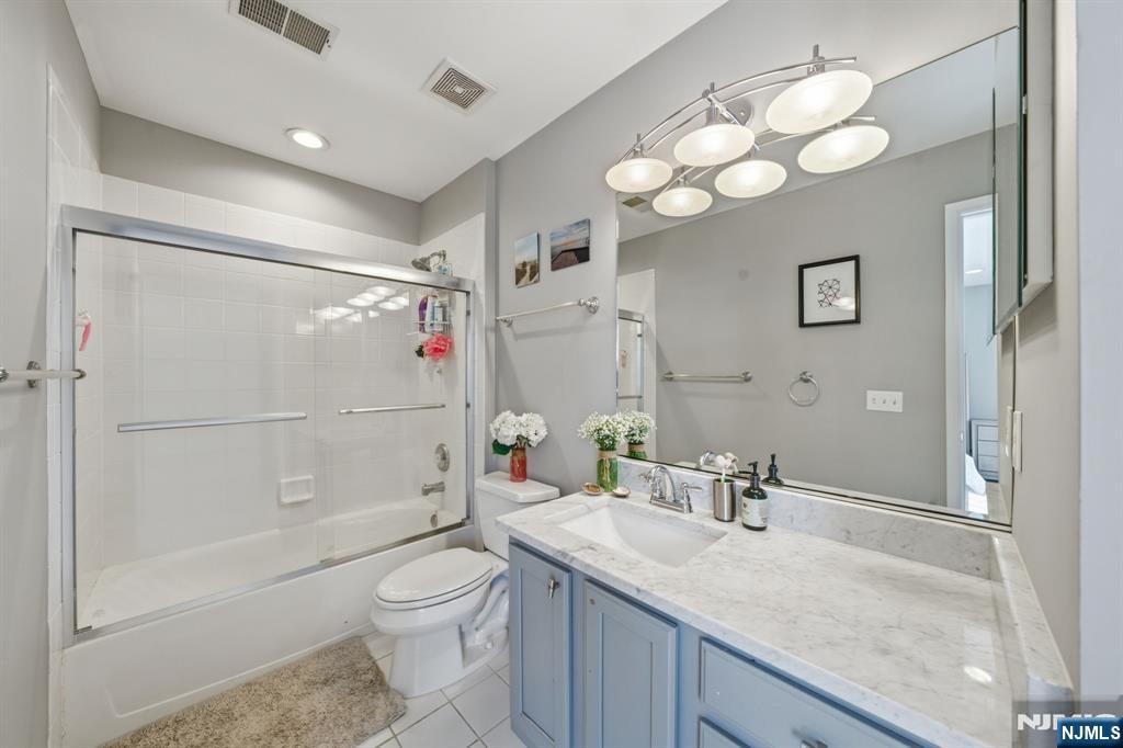 22 Falling Waters Oakland, NJ 07436 - Photo 31 of 43 a bathroom with a granite countertop sink a toilet and shower