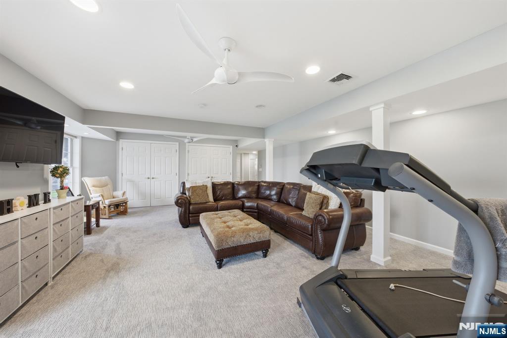 22 Falling Waters Oakland, NJ 07436 - Photo 32 of 43 a living room with furniture and a flat screen tv