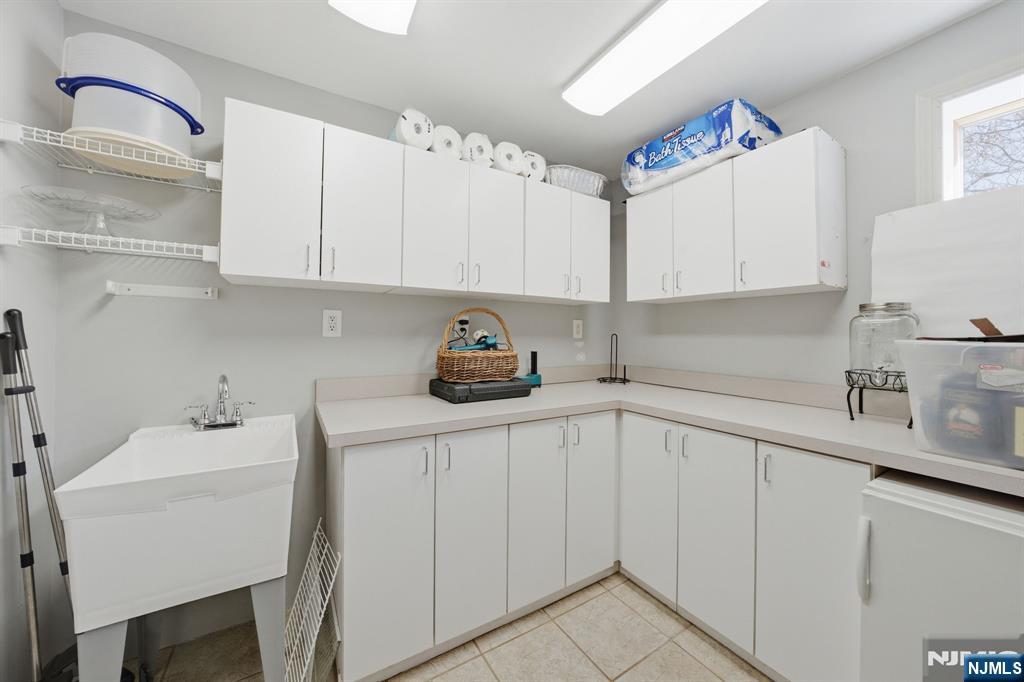 22 Falling Waters Oakland, NJ 07436 - Photo 34 of 43 a kitchen with a sink cabinets and appliances